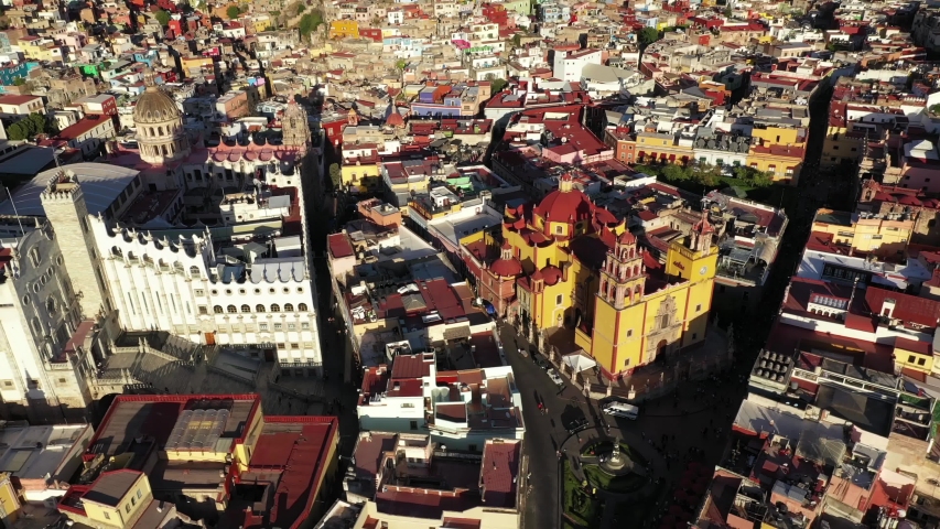 Drone Aerial of Plaza De La Paz Basilica Colegiata de Nuestra Senora Cathedral and University of Guanajuato City in Central Mexico 4k