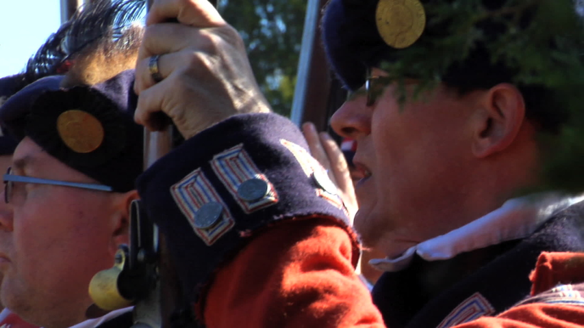 VIRGINIA - OCTOBER 2016 - Reenactment, large-scale, epic American Revolutionary War anniversary recreation -- Army Soldiers in formation marching as on parade with Muskets, flags & drums.