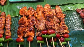 video of chicken skewers with fresh tomatoes and peppers on a wooden skewer grilled