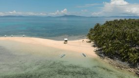 Drone flight over banka outrigger boats on the island of Siargao in the Philippines