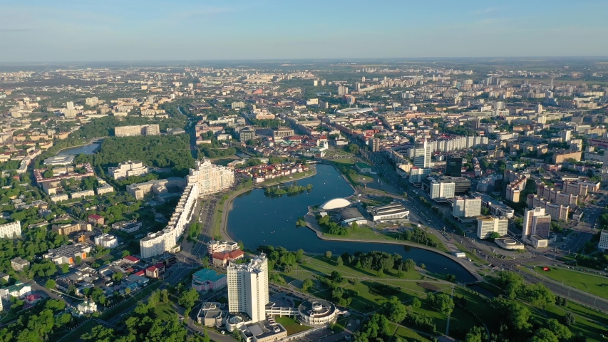 MINSK, BELARUS - MAY, 2019: Aerial drone shot view of Nemiga and Pobeditelei avenue, city centre from above at sunny day. Streets with residential and business buildings.