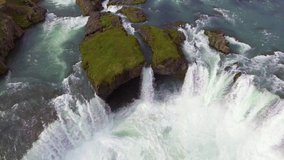 Drone aerial view of the Godafoss famous waterfall landscape in Iceland. The breathtaking landscape of Godafoss waterfall attracts tourist to visit the Northeastern Region of Iceland.