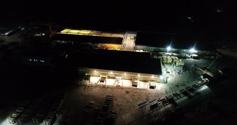 Flying over the sawmill at night