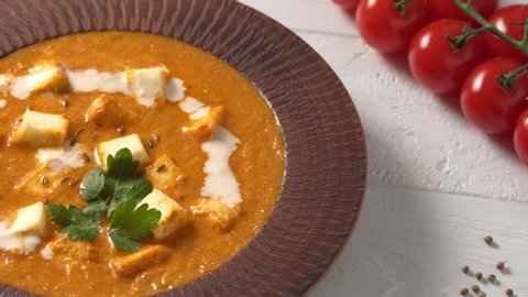 Shahi paneer Indian rustic traditional vegetarian masala gravy meal with vegetables and white sauce