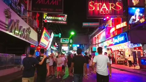 PATTAYA, THAILAND - MAY 25, 2019 : Hyperlapse of crowd walking Street in Pattaya at night on red-light street. Walking Street area includes a go-go bars, nightclubs of Pattaya, Thailand.