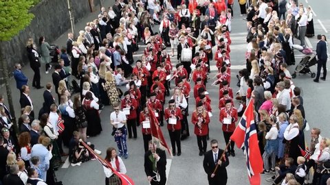 Stavanger, Rogaland / Norway - May 17, 2019: Participants and spectators of the national parade on Norwegian Constitution Day. The video is recorded with environmental sound.
