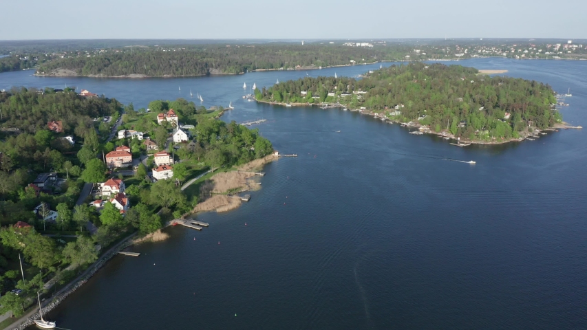 Swedish archipelago. and luxurious waterfront home in Stockholm. Island close to Djursholm Danderyd and Lidingo. Aerial drone shot high angle view Royalty-Free Stock Footage #1030386542