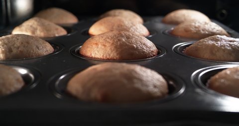 4K - Baking cupcakes in oven. time lapse shot