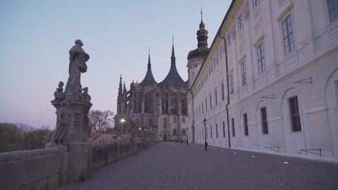 Walking towards St. Barbara's Cathedral in Kutna Hora, Czech Republic, evening shot with lights on