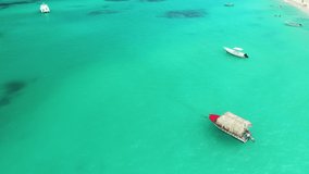 Yachts and boats sailing on clear turquoise water of tropical caribbean sea, aerial top view