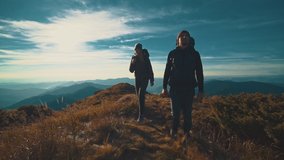 The happy couple with camping backpacks standing on the mountain - Powered by Shutterstock - Get 15% off with code: PIKWIZARD15