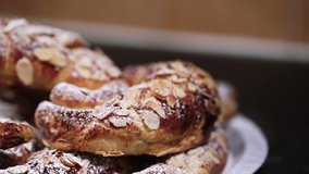 SLOW MOTION Shot of beautiful almond croissants in a plate being powdered with white sugar - 1080p Slide shot from Right to Left at 120fps - Powered by Shutterstock - Get 15% off with code: PIKWIZARD15