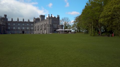 Panning shot of beautifully landscaped gardens, at kilkenny castle and manor house.