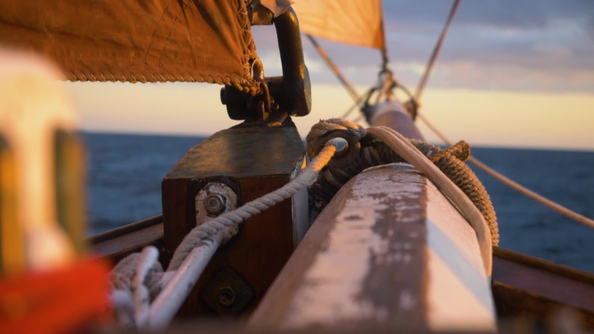 Close Up Bowsprit of Large Wooden Boat Sailing at Sunset. Royalty-Free Stock Footage #1030432253