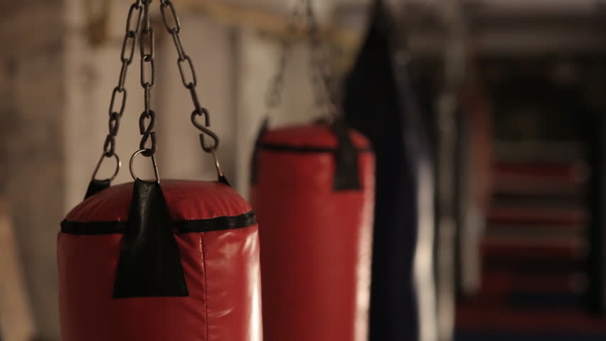 Punching bag swaying in a dark gym Royalty-Free Stock Footage #10304339