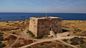 The Castell on the small and romantic Spanish island Tabarca. The sun is shining and the Mediterranean is blue. Aerial video with semicircle flight around the Castell.