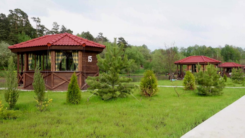 Beautiful view of the fishing pond with gazebos, 4k video