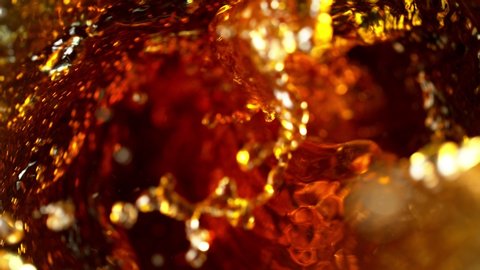 Super slow motion of pouring cola drink in twister shape. Filmed on high speed cinema camera, 1000 fps.
