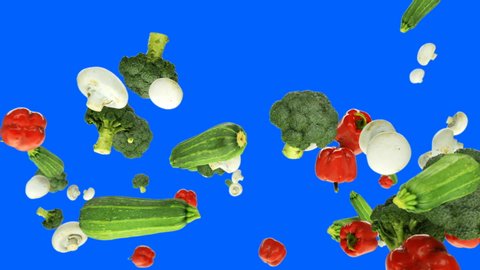 Bell Pepper, Mushrooms, Broccoli and Zucchini flying in slow motion, against Blue Screen