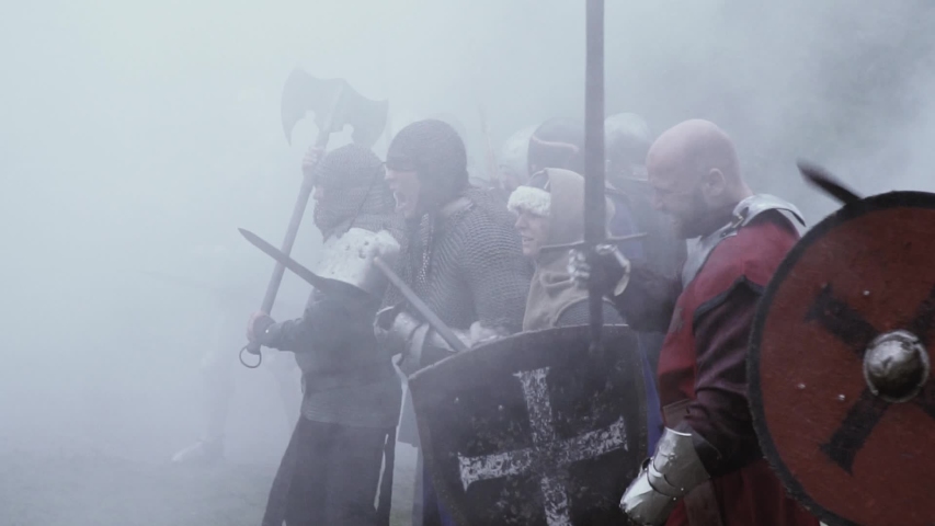 Soldiers in medieval are screaming and rushing into the battle