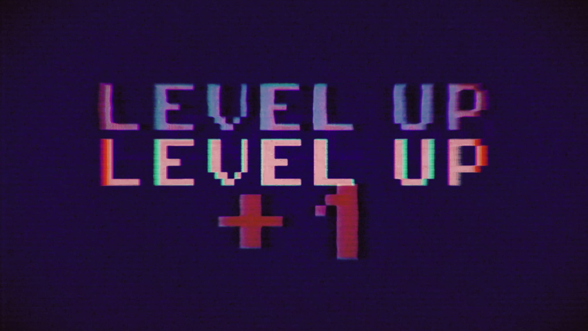 A pink and purple videogame screen animation, with the text Level up - Plus one. VHS vignetted capture effect.
 | Shutterstock HD Video #1030456331