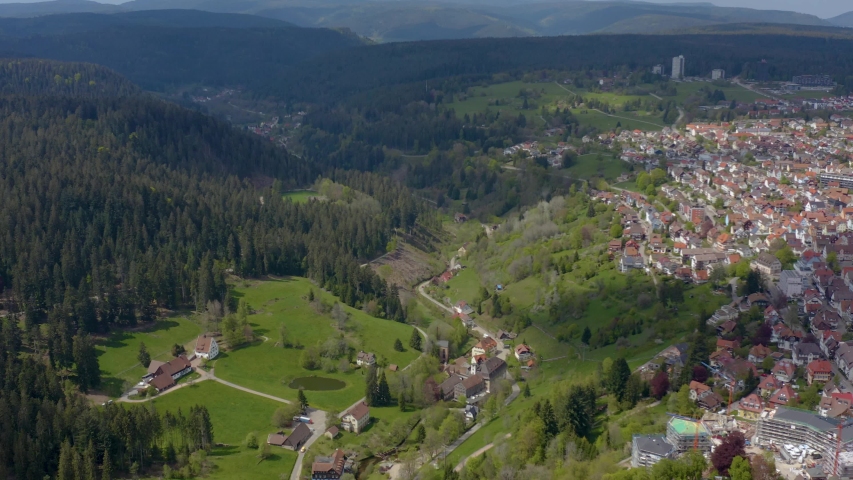 Aerial pan to the right from the woods to Freudenstadt in the black forest Schwarzwald