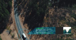 autonomous self Driving truck car driving on a forest highway with technology assistant tracking information, showing details. Visual effects clip