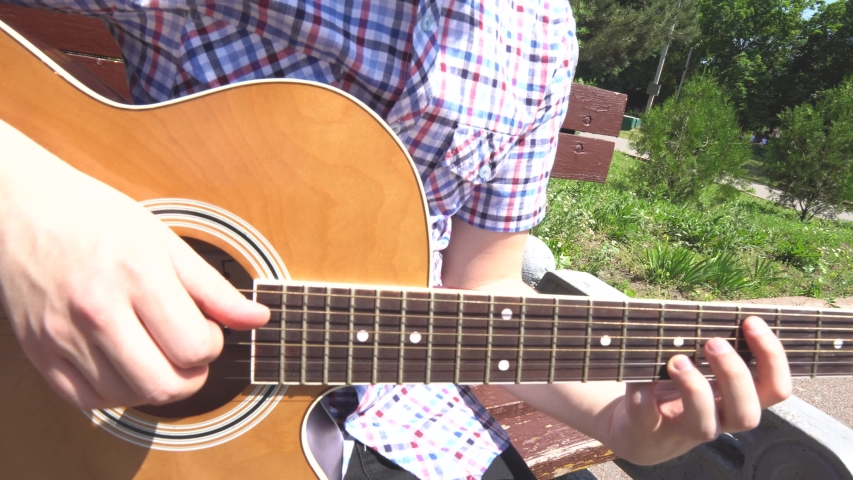 Man playing music on guitar