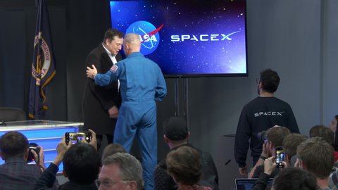 KENNEDY SPACE CENTER, FL - March 2, 2019. Elon Musk of SpaceX and NASA personnel and astronauts participate in a post-launch briefing after the rocket launch of Crew Dragon Demo-1. B-roll.