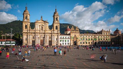 Bogota, Colombia - December 14: Time lapse view of people at Bolivar Square and historical landmark Metropolitan Cathedral of Bogota, located in the heart of the Historic Center in Bogota, Colombia.