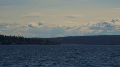 Camano Island State Park, Washington State. Mid-afternoon, late-Spring. Looking Westward over Elger Bay and Saratoga Passage toward Whidbey Island. 55 sec/24 fps. 