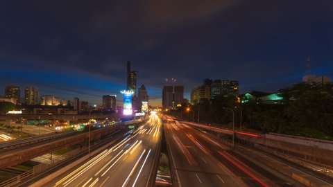 Traffic light trails of cityscape Time Lapse from day to night in Kuala Lumpur city at sunset. Federal Territory, Malaysia