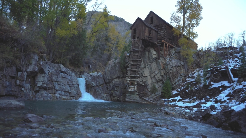 Historic wooden powerhouse called the Crystal Mill in Colorado in autumn colors. It is located on an outcrop above the Crystal River in Crystal ghost town and was built in 1892. 4K UHD video.