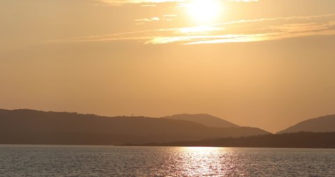 sunset view over the sea from Alghero Coats line port in Sardinia, Italy