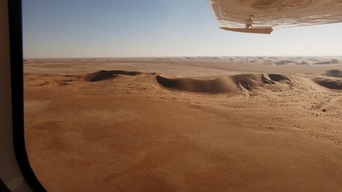 Looking out under the wing across the endless dunes of the Namib desert.