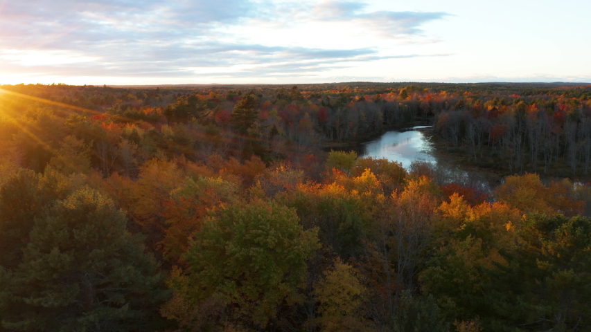 Runaround Pond Fly Over Aerial Drone Footage at Sunset, Maine, USA