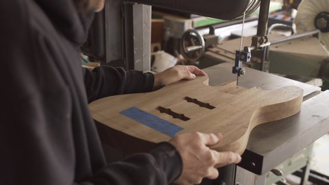 Making solid wood guitar body – Stockvideo