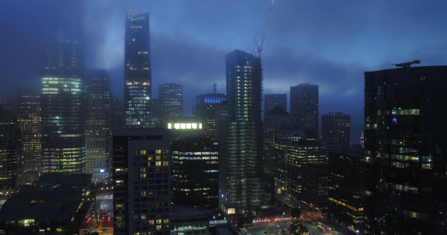 SAN FRANCISCO, CALIFORNIA, USA. 4K shot of mist over the San Francisco skyline. Urban downtown night view.