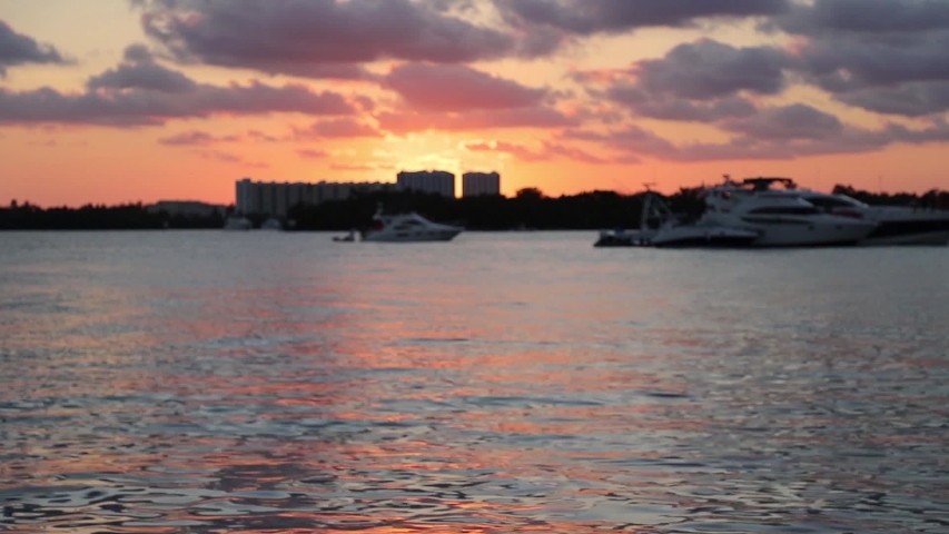 Sunset in Miami.Fishing and Sail Boats in South Florida. Selective focus