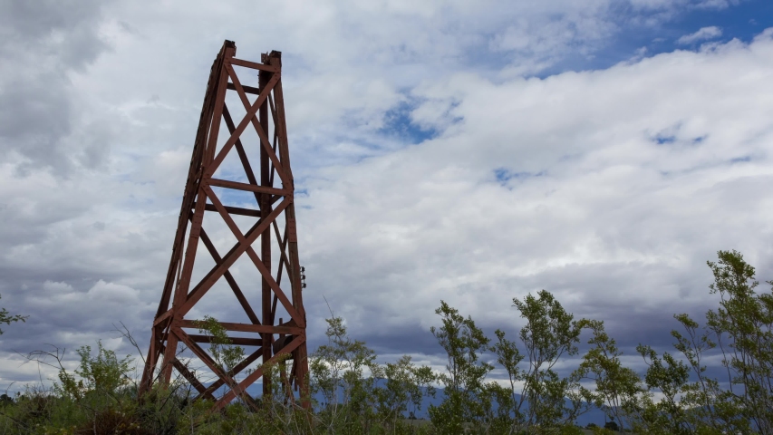 Time Lapse of Clouds Passing Over a Old Water Tower