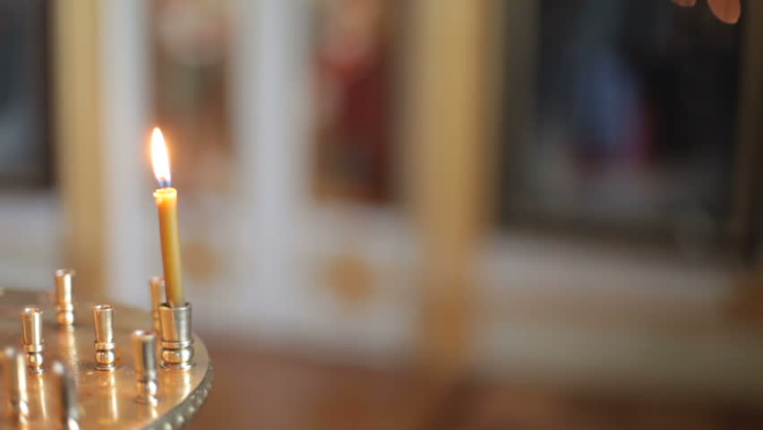 burning candle in a church
