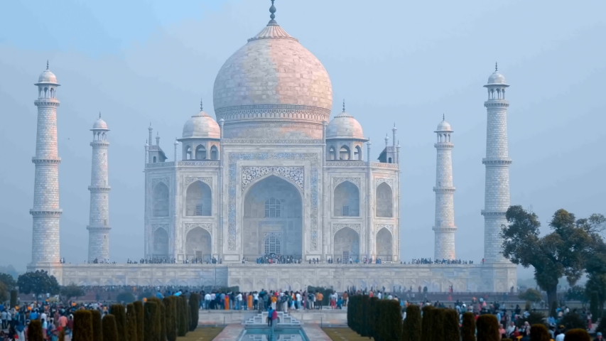 Taj Mahal - a mausoleum mosque, combines elements of Indian, Persian and Arab architectural styles, located in Agra, India, on the banks of the Yamuna River. Shot in motion