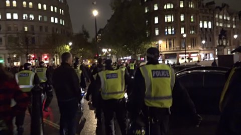 London, United Kingdom (UK) - 11 05 2015: A unit of riot police follow a night time protest