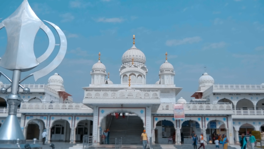 Beautiful temple from white marble in India, one of the sacred pilgrimage sites in Hinduism. Shot in motion