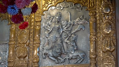 Beautiful ?hasing to brass and silver in indian traditional style about Indian gods in a temple of india