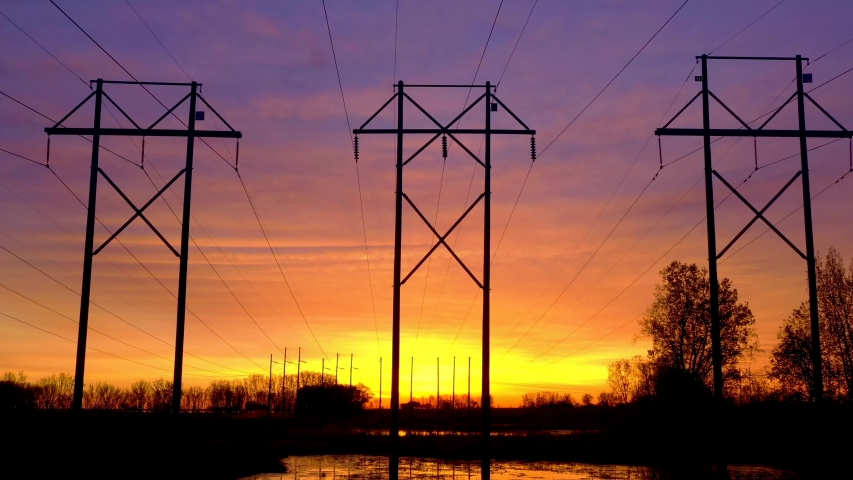 The grid out of control, electrical cables completely filling the beautiful dawn sky.
