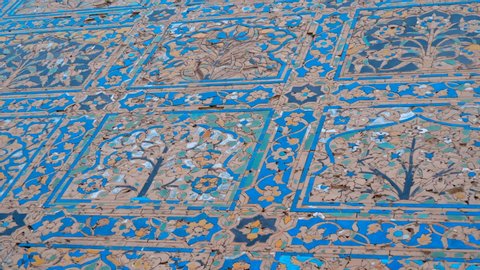 Amazing, beautiful blue floral patterns on the walls in the ancient Indian temple in one of the buildings in complex Taj Mahal, Agra, India. Shot in motion