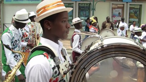 Marigot, Saint Martin - July 14 2013: Creole band with  Drums at Parade on the 14th July, the French National Holiday in Marigot. Afro-Caribbean Musicians celebrating Bastille Day.