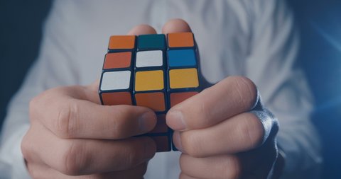 Kiev, Ukraine, May 07 2019: Rubik's cube in the hands of a man close up