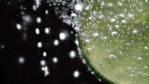 soda sparkling water bubbles, limes slice cold cocktail.